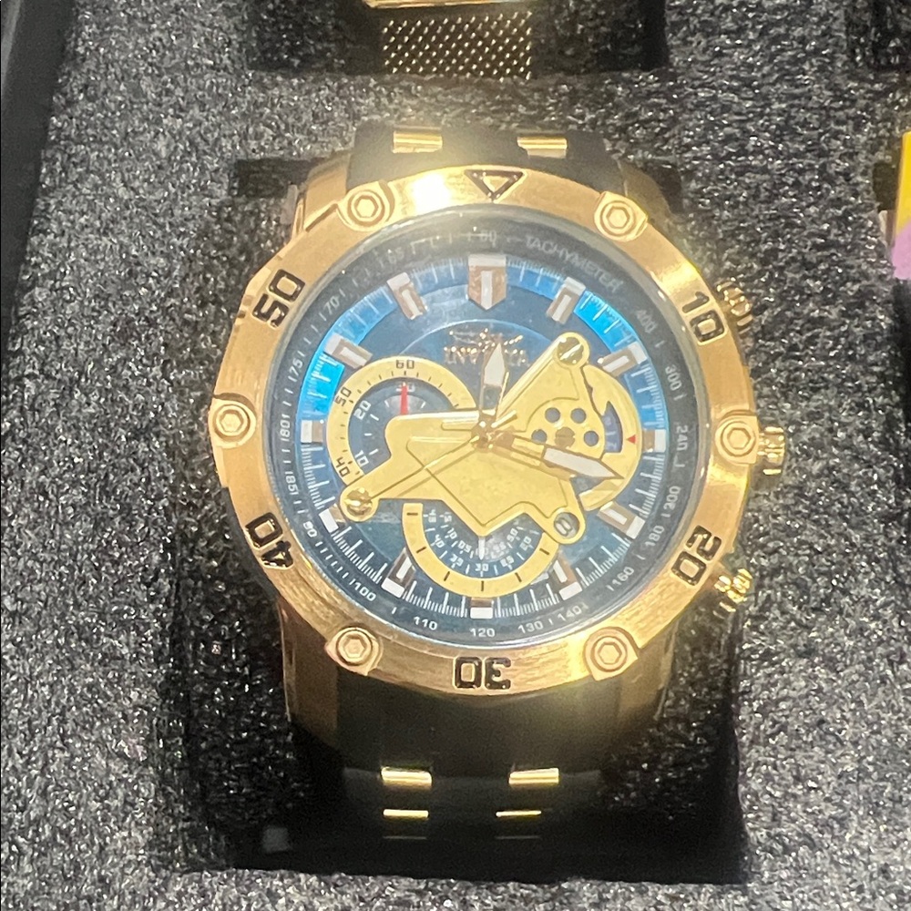 Invicta Gold and Black Watch with Blue Dial